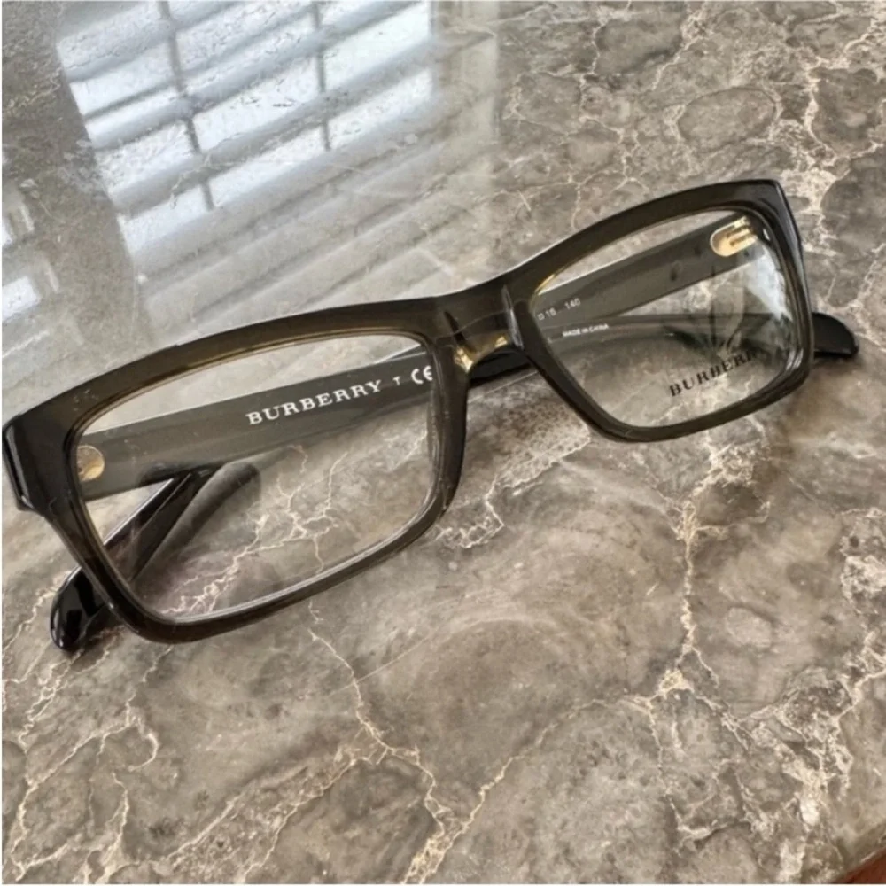 Burberry Elegant Black and Brown Glasses